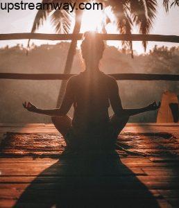 Woman Meditating Beneath a Palm Tree